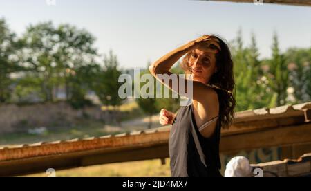 woman touching her head Stock Photo
