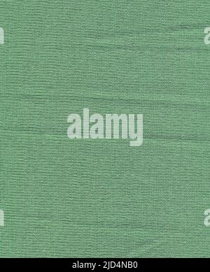 Warm mint blue woolen braids are knitted with threads background. Acrylic or cotton mint handmade knit fabric canvas texture. Stock Photo