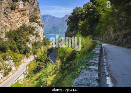STRADA DELLA FORRA, narrow Italian road with tunnel in the mountains, Lake Garda, Italy Stock Photo