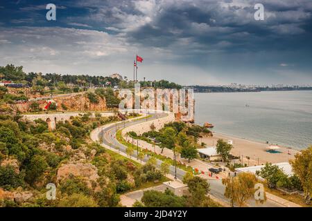 19 May 2022, Antalya, Turkey: scenic panoramic view with winding road decorated for holiday with numerous flags. Travel destinations of Turkey and Ant Stock Photo