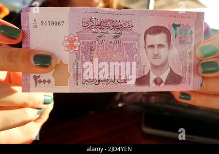 Syria, Syria. 17th June, 2022. Portrait of Syrian President Bashar al Assad on a Syrian banknote, June 17 2022 (Photo by Elisa Gestri /Sipa USA) Credit: Sipa USA/Alamy Live News Stock Photo