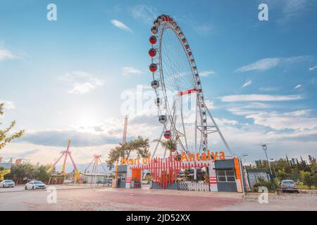19 May 2022, Antalya, Turkey: Heart of Antalya ferris wheel in amusement park against sky background. Entertainment and fair concept. Stock Photo