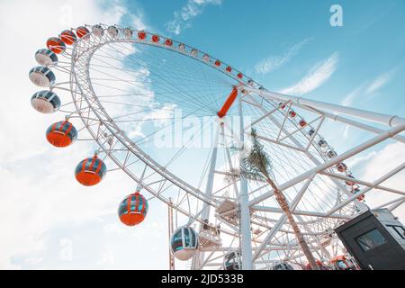 19 May 2022, Antalya, Turkey: Heart of Antalya ferris wheel in amusement park against sky background. Entertainment and fair concept. Stock Photo