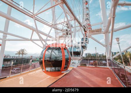 19 May 2022, Antalya, Turkey: Heart of Antalya ferris wheel entrance platform to the cabins in amusement park Stock Photo