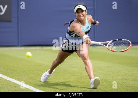 Heather Watson of Great Britain playing single handed backhand in her game with Urszula Radwanska of Poland on Court 2 at Devonshire Park, Eastbourne Stock Photo