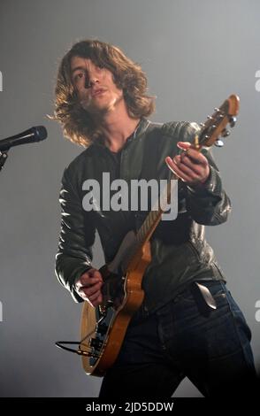 Arctic Monkeys  lead singer Alex Turner performs on stage at SECC on November 24, 2009 in Glasgow, Scotland. (Photo by Ross Gilmore) Stock Photo
