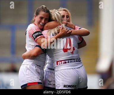 EnglandÕs Amy Hardcastle celebrates scoring her sides second try with Jodie Cunningham and Tara Jones during the Women's International match at the Halliwell Jones Stadium, Warrington. Picture date: Saturday June 18, 2022. Stock Photo