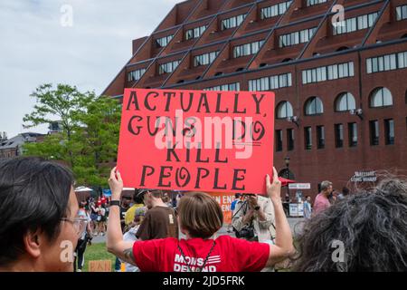 Boston, MA, US-June 11, 2022: March for Our Lives Protest Rally in Boston's Christopher Columbus Park in the North End. Protesters holding anti-gun si Stock Photo