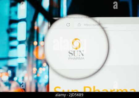 In this photo illustration, the homepage of the Sun Pharmaceutical website seen on a computer screen through a magnifying glass. Stock Photo