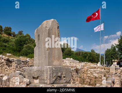 Inscribed Pillar or Xanthian Obelisk( Xanthos Stele), with inscriptions of old three languages in ancient city Xanthos, Turkey Stock Photo
