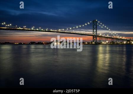 The Ambassador Bridge, connecting Detroit and Windsor across the Detroit River, is the busiest border crossing between the United States and Canada. Stock Photo