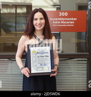 Van Nuys, California, USA. 17th June, 2022. Actress Vida Ghaffari holds the Certificate of Recognition that she was awarded by California State Assemblyman Adrin Nazarian at the Van Nuys District Office in Van Nuys, California. Credit: Sheri Determan Stock Photo