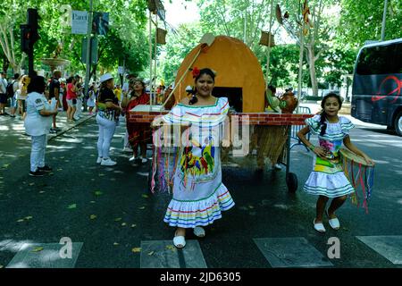 Madrid, Spain. 18th June, 2022. Kids from the Bolivian origin dance during the carnival parade of the Flor del Patujú festival at the Paseo del Prado in Madrid. Credit: SOPA Images Limited/Alamy Live News Stock Photo