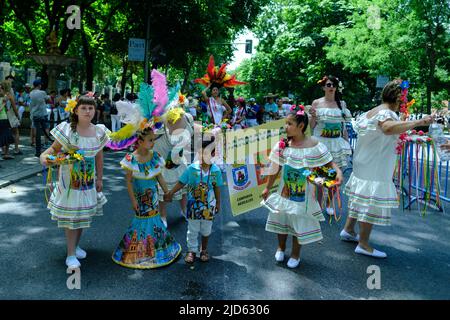 Madrid, Spain. 18th June, 2022. A group of kids from the Bolivian origin dance during the carnival parade of the Flor del Patujú festival at the Paseo del Prado in Madrid. Credit: SOPA Images Limited/Alamy Live News Stock Photo