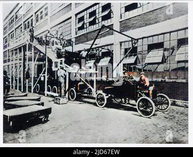 Working on the Ford assembly line in Detroit, USA. Here, car bodies are united with the chassis. Colourised version of : 10018142       Date: 1909 Stock Photo
