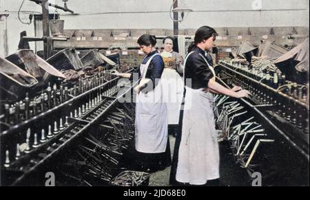 Bobbin winding in a Lancashire cotton mill. Colourised version of : 10095331       Date: circa 1900 Stock Photo