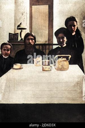 RASPUTIN takes tea with the tsarina Alexandra and two of her children, Colourised version of : 10173416       Date: circa 1912 Stock Photo