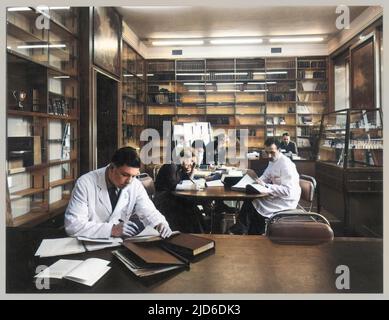 Students at Edinburgh University, apparently studying science, read and make notes in a library Colourised version of : 10178171       Date: 1950s Stock Photo