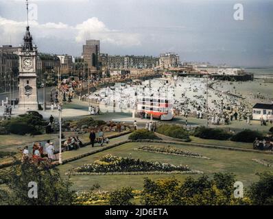 The busy beach, promenade and clock tower at Margate, Kent, England. Colourised version of : 10161353       Date: 1950s Stock Photo