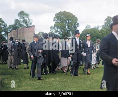 The well-to-do crowd at a cricket match held on 4 June at Eton College, England, including pupils in top hats, well-heeled parents and the college chaplain or priest. Colourised version of : 10163436       Date: 4 June (early 1930s) Stock Photo