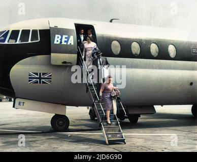 Passengers disembarking from a BEA aeroplane (a Vickers Vanguard) which has just landed at London (now London Heathrow) Airport, Middlesex, England. Colourised version of : 10172023       Date: 1960s Stock Photo