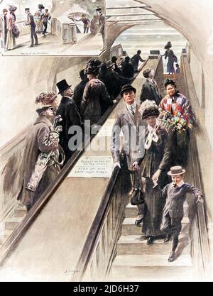 First escalators ever installed on the underground, between the District and the Piccadilly line platforms at Earls Court station. At the time, they provided great entertainment for the passengers using them. Colourised version of: 10216058       Date: 1911 Stock Photo