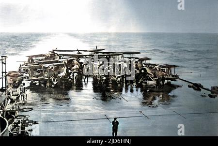 Fleet Air Arm 'Swordfish' torpedo-bombers gathered on the stern of the Royal Navy aircraft-carrier HMS 'Victorious', during the Second World War, 1941. Colourised version of: 10220199       Date: 1941 Stock Photo