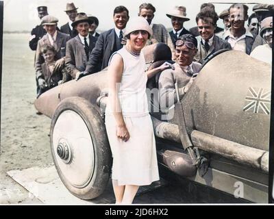 Sir Malcolm Campbell (1885 - 1948), Lady Dorothy Evelyn Campbell (nee Whittall) after a successful world land speed record attempt on Pendine Sands, Carmarthenshire, 1925. Colourised version of: 10222616       Date: 1925 Stock Photo