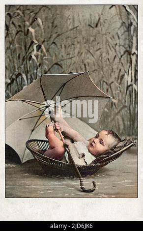 Small Baby boy in a Moses Basket amid the reeds. The child is showing admirable resourcefulness in taking along a brolly, in case of showers or passing high speed motor boats...    From Exodus 2 (verses 5-6): 'Then Pharaoh?s daughter went down to the Nile to bathe, and her attendants were walking along the riverbank. She saw the basket among the reeds and sent her female slave to get it. She opened it and saw the baby. He was crying, and she felt sorry for him. ?This is one of the Hebrew babies,? she said.' Colourised version of: 10644784       Date: 1904 Stock Photo