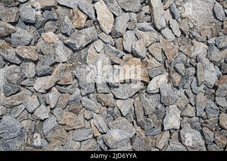Lots of grey granite stones as abstract nature background. Stock Photo