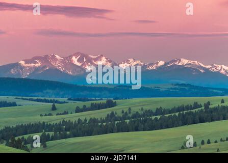 first light on the flint creek range above foothills near avon, montana Stock Photo