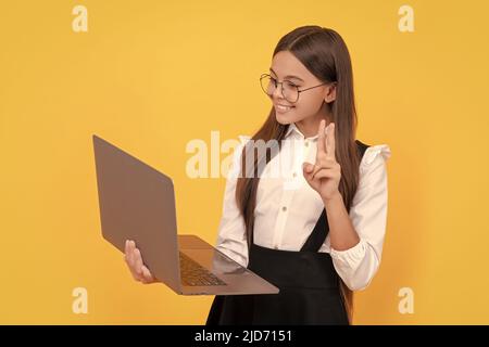 kid in glasses. teen girl use laptop for communication. modern education. back to school. Stock Photo