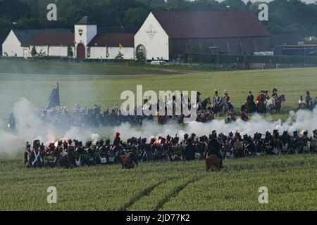 Waterloo, Belgium. 18th June, 2022. Re-enactors attend the re-enactment of the 1815 Battle of Waterloo in Waterloo, Belgium, June 18, 2022. About 2,000 re-enactors, more than 100 horses as well as over 20 canons participated in the re-enactment, showing the clash of June 18, 1815 between Napoleon and Wellington. The event marked the 207th anniversary of the Battle of Waterloo. Credit: Zheng Huansong/Xinhua/Alamy Live News Stock Photo
