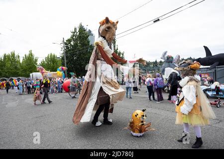 Seattle, Washington, USA. 18th June, 2022. Participants prepare for the Fremont Solstice Parade. The iconic, annual parade returned after a three-year hiatus due to the coronavirus pandemic. Credit: Paul Christian Gordon/Alamy Live News Stock Photo