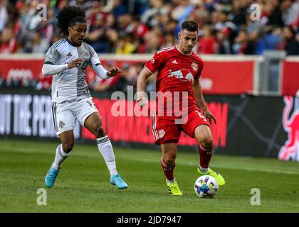 Harrison, NJ, USA. 18th June, 2022. New York Red Bulls defender Dylan Nealis (12) beats Toronto FC forward Jayden Nelson (11) to the ball during a MLS game between the Toronto FC and the New York Red Bulls at Red Bull Arena in Harrison, NJ. New York defeated Toronto 2-0. Mike Langish/Cal Sport Media. Credit: csm/Alamy Live News Stock Photo