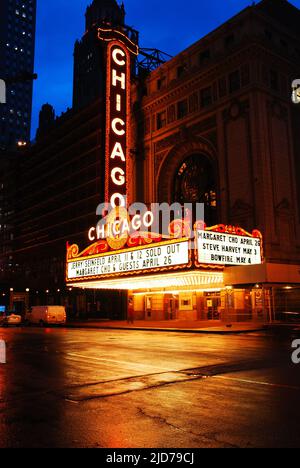 The Historic Chicago Theater brightens a rainy night in the Loop Stock Photo