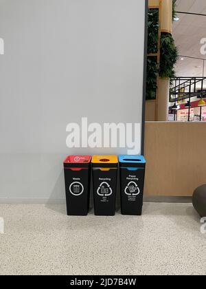 Auckland, New Zealand - 3 June 2022: Recycle bins in Auckland Airport Stock Photo