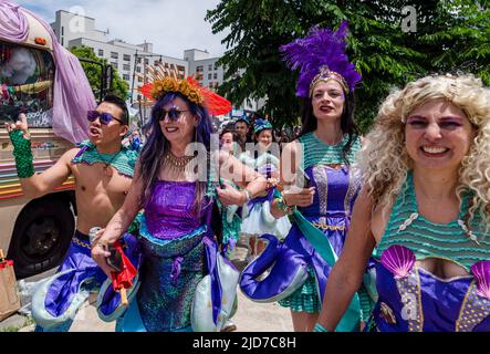 Coney Island, United States. 18th June, 2022. A group of matching mermaids walk to their float. The Coney Island Mermaid Parade is the largest Art Parade in the United States. The parade celebrates the start of summer. Revelers dress as mermaids, fish and other sea creatures. (Photo by Aimee Dilger/SOPA Images/Sipa USA) Credit: Sipa USA/Alamy Live News Stock Photo