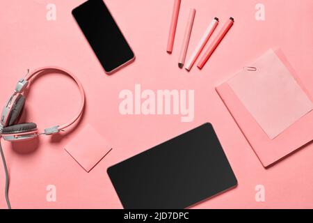 Business objects for planning work, smartphone and eyeglasses of manager on pink backgraund Stock Photo