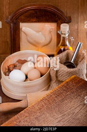 kitchen still life with eggs. Cook at home. Simple products - flour and eggs on wooden table Stock Photo