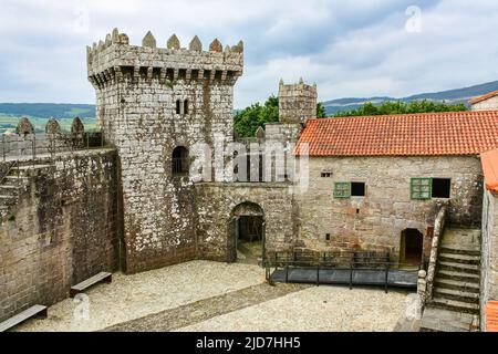 Medieval castle in the north of Spain with wall and period houses. Galicia. Stock Photo