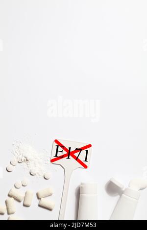 Titanium dioxide, E171, dangerous additive concept. gum, pills ...