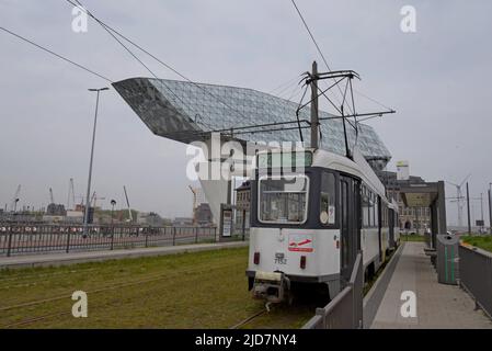 De Lijn tram at the Havenhuis tram stop for the  Antwerp Port Authority headquarters building, Antwerp, Belgium Stock Photo