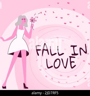 Inspiration showing sign FALL IN LOVE. Business approach Charmed or captivated with someone Valentines Day Woman blowing bunch of flowers displaying Stock Photo