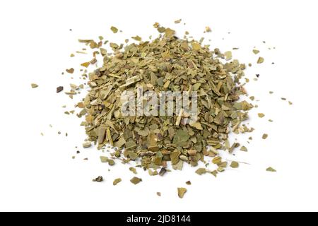 Heap of South American dried Mate tea leaves close up isolated on white background Stock Photo