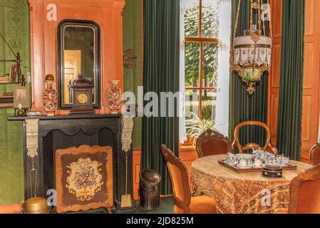 Enkhuizen, Netherlands, June 2022. The interior of a Dutch living room from the 1920s. High quality photo