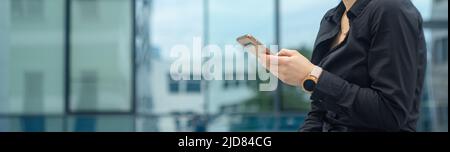 Successful businesswoman using smart phone, banner with space for text. Stock Photo