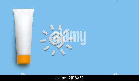 White blank cosmetic tube with sunscreen cream and plasticine sun on blue background. Mockup Stock Photo