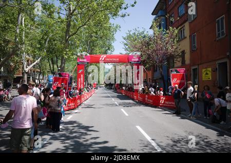 Borgo Val di Taro, Parma, Italy - May, 2022: People stand along street waiting for peloton of cyclists at 12th stage of Giro d'Italia cycling race Stock Photo