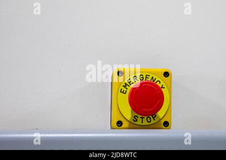 red emergency stop push button on engine Stock Photo